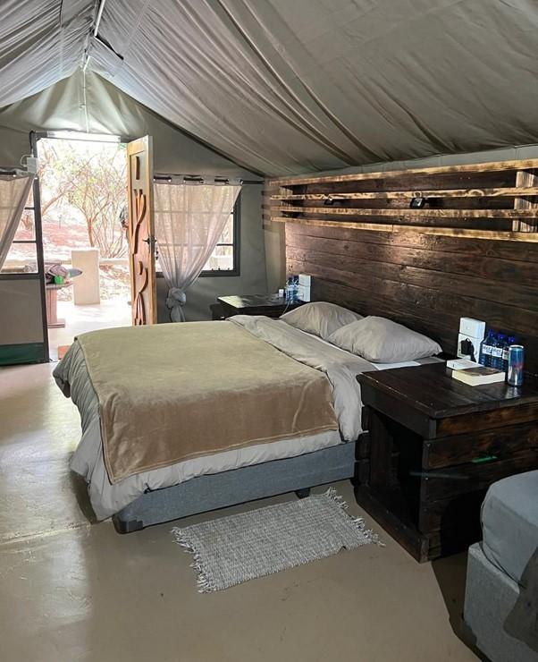 A bedroom in tented accommodation