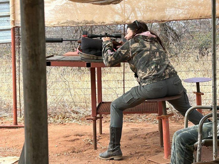 Lady on the shooting range, practicing for the hunt