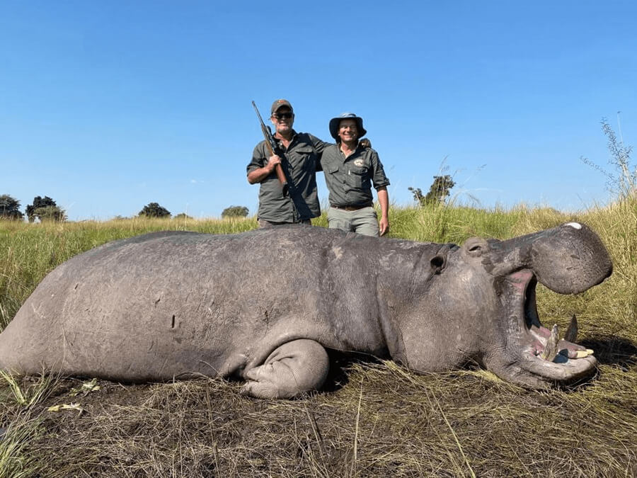 Author Pierre van Wyk poses with his hippo and the local outfitter during his hippo hunting safari in Namibia